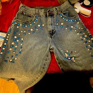 Blue denim jeans w/ blue and clear jewels. machine wash cold.Do not use dryer..